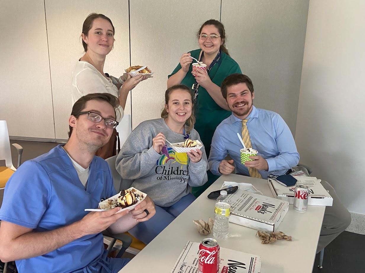 group picture of five pediatric residents posing with refreshments